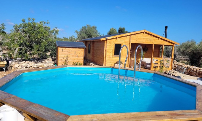 L'Ametlla de Mar Ski Chalet | Romantic chalet with private pool surrounded by olive trees.