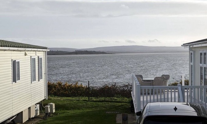 Hamworthy House | Safari Sunset caravan + sea view at Rockley Park, Poole Harbour. Dogs stay free!