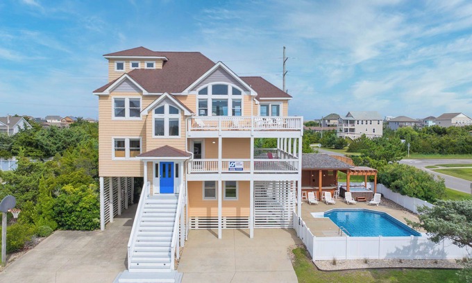 Wind Over Waves House | Soundside Dog Friendly Home w/Pool, Hot Tub, Game Room, Tiki Bar, Public Dock