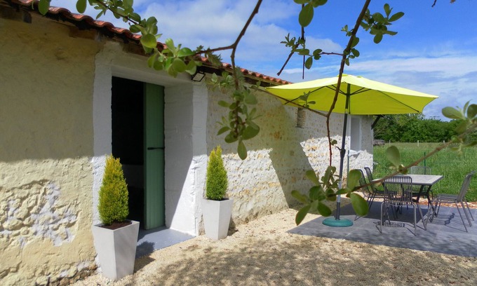 Soumeras House | Spacious, double height, beamed main space. This gite is in a rural setting.