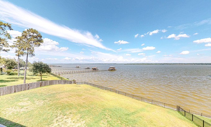 Lake Houston House | Spacious lakefront home with patio, grill, W/D, WiFi, & central AC