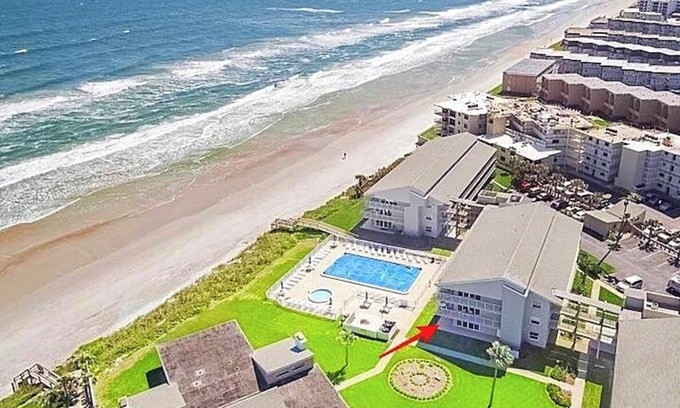 New Smyrna Beach Condo | STUNNING ground floor condo, direct OCEAN front, steps to community pool!