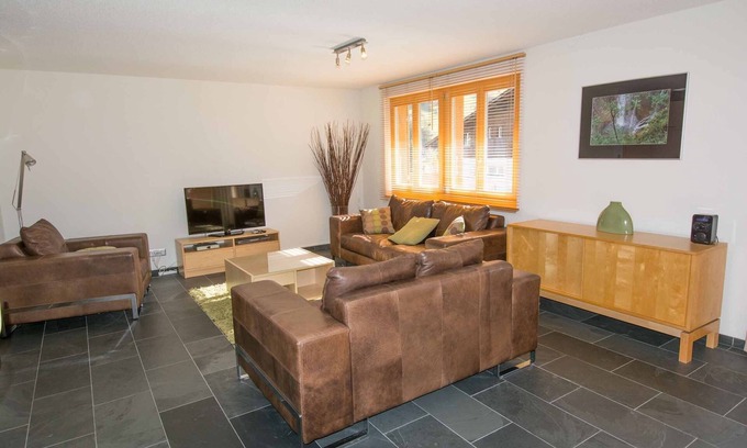Adelboden Apartment | Stylishly furnished vacation apartment near the mountain railroads.