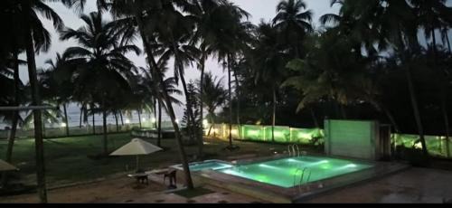 Malpe House | Swimming pool beach front resort