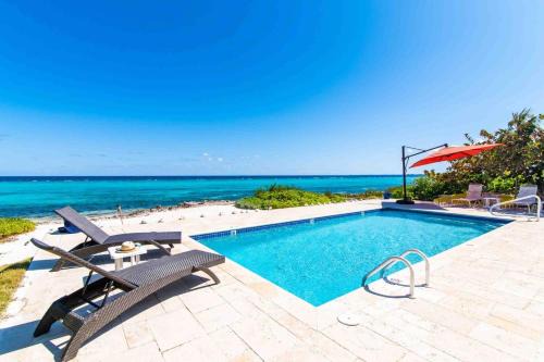 Rum Point Villa | Thatch Hill - Renovated Beach House with Pool, Short Walk to the Rum Point Club