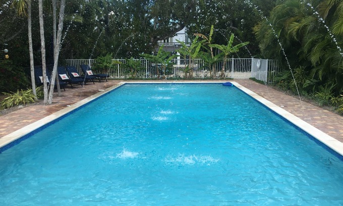 Eden Pines House | Tropical 5BR Paradise, Private Pool, Hot Tub, Canal Access – Sleeps 12