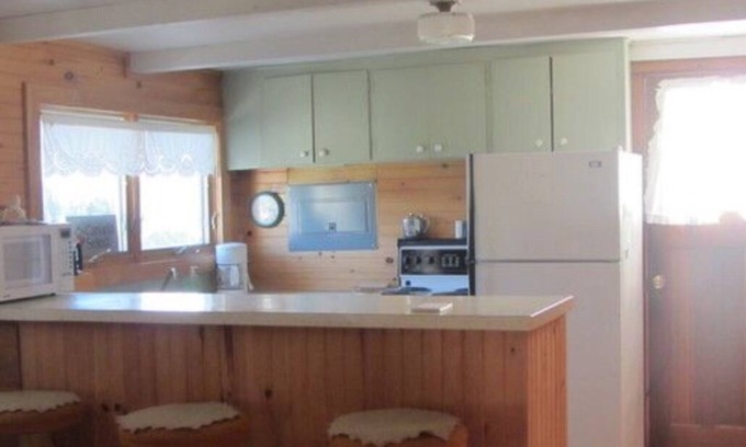 Morell Cottage | Two Bedroom Cottage With Open Concept Leading To Large Patio And Screened Porch.