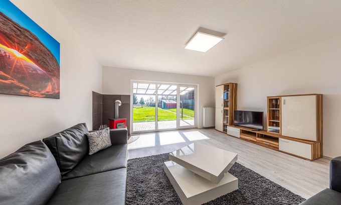 Muritz House | Vacation home with fireplace, covered terrace and garden