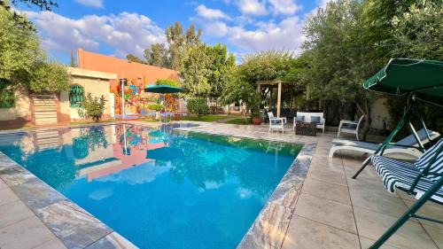 Tameslouht Villa | Villa familiale avec piscine privée, jardin spacieux et vue Atlas