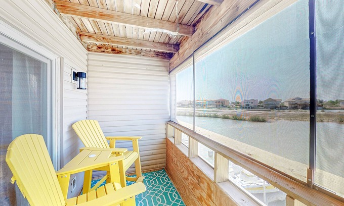 Port Isabel Condo | Water-view downtown condo with outdoor pool, balcony, W/D, AC - 30 day min stay