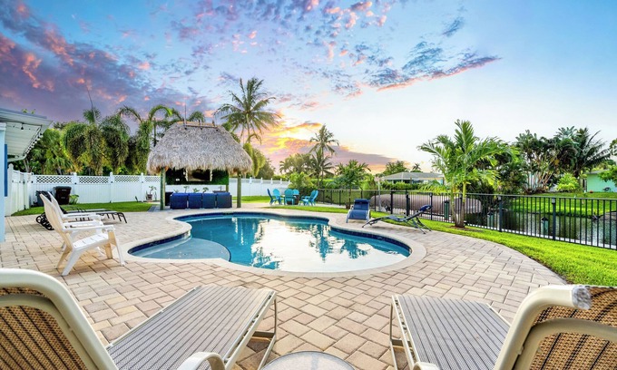 Lake Clarke Shores House | Waterfront Escape with Heated Pool, Mini-Golf, TikiHut in West Palm Beach
