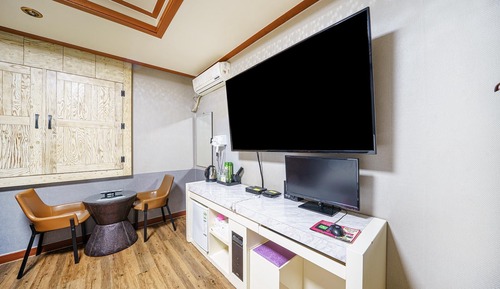Room (Massage chair (65 inch TV Netflix ava)