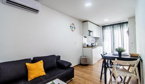 One-Bedroom Apartment with Balcony and City View