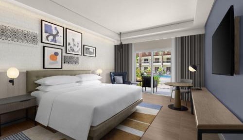 Deluxe King Room with Balcony and Pool View