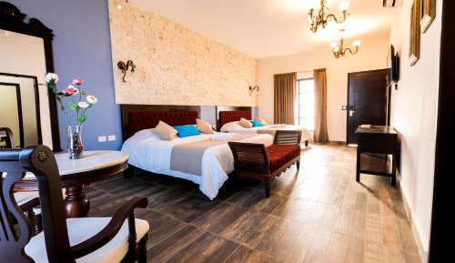 Master Suite 2 king size beds, living room, pool and garden view