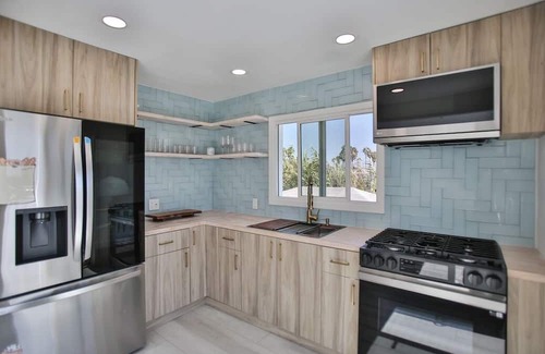 Huntington Harbour Cottage | STEPS TO PRIVATE BEACH FRONT PANORAMIC OCEAN VIEWS! Home - parking lot - sand.