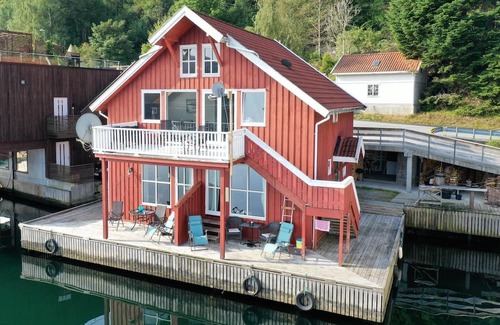 Flekkefjord Apartment | Holiday apartment "Fagerstrand 1", in Flekkefjord, southern Norway, in a beautiful location directly on the water, 4-6 persons, open living-dining area, 2 bedrooms, 1 loft with double mattress, 1 bathroom, Internet, own small veranda with access t...