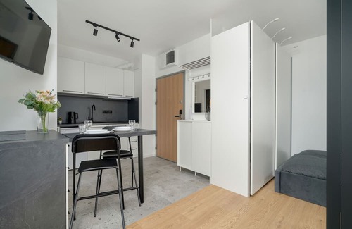 Jezyce Apartment | Dark Grey Apartment in Poznan by Renters