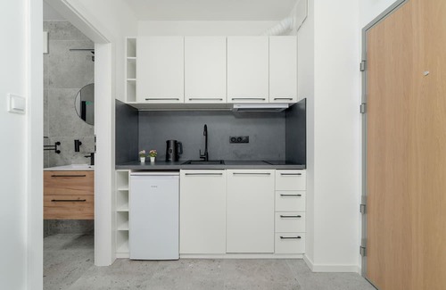 Jezyce Apartment | Dark Grey Apartment in Poznan by Renters