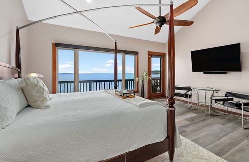 Sandpoint House | Waterfront home with private dock, beach, hot tub & wrap-around deck