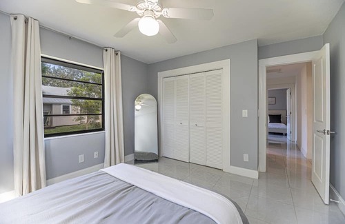 Palm River Estates House | Gorgeous Naples home with open-concept layout, sunroom, enclosed pool, & AC