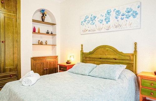 El Portil Apartment | Enjoy a relaxing vacation in this inviting vacation home with a community pool.