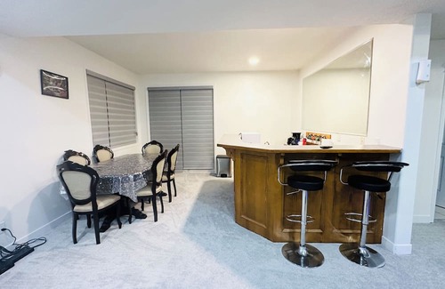 Chestermere House | Delightful ground level basement with AC in charming Chestermere