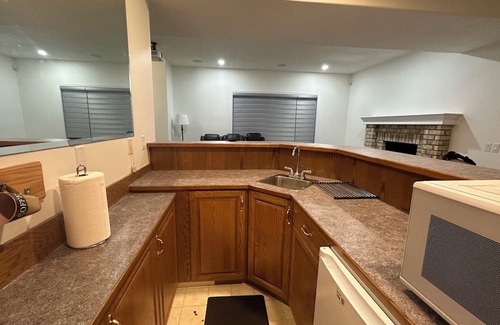 Chestermere House | Delightful ground level basement with AC in charming Chestermere