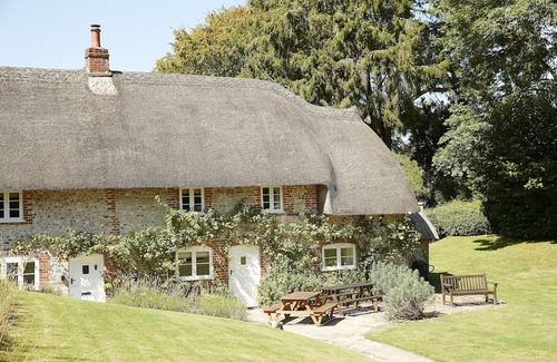 Ebbesborne Wake Cottage | This beautiful 300-year-old detached thatched cottage nestled within the stunning Cranborne Chase.
