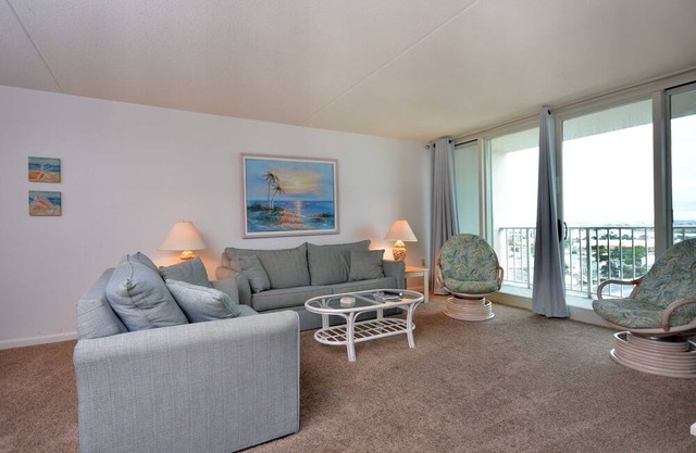 Cozy two bedroom condo, set with calming beach themes in a beautiful, family friendly, ocean front building
