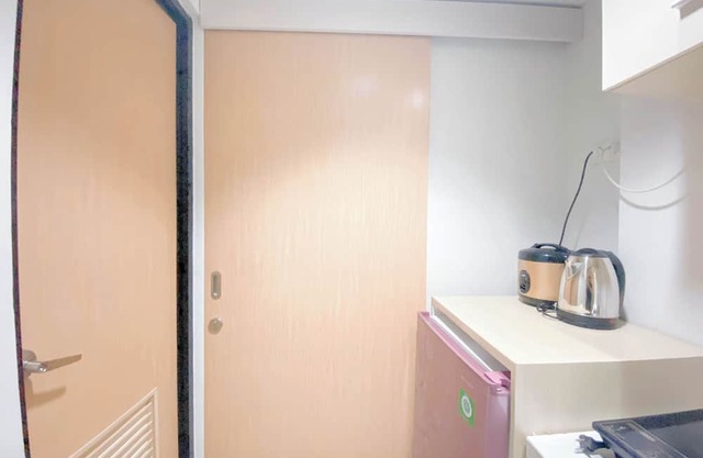 Simple White Studio Apartment At The Alton Semarang