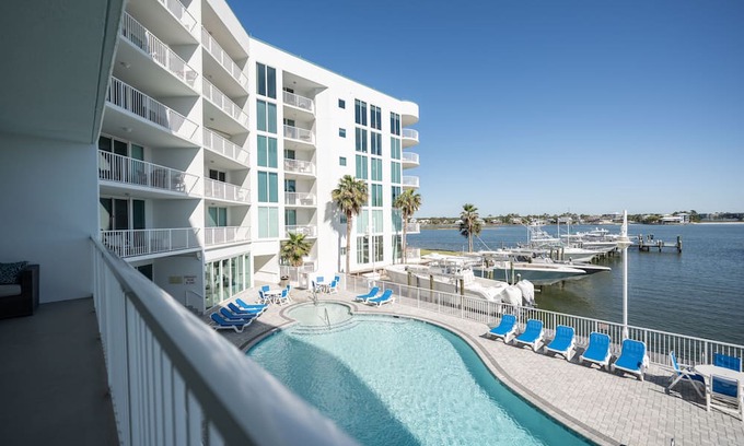 Orange Beach Condo | Luxe & Comfy Waterfront Gem: Heated Pool, Sandy Beach, Kayaks, Panoramic Views!
