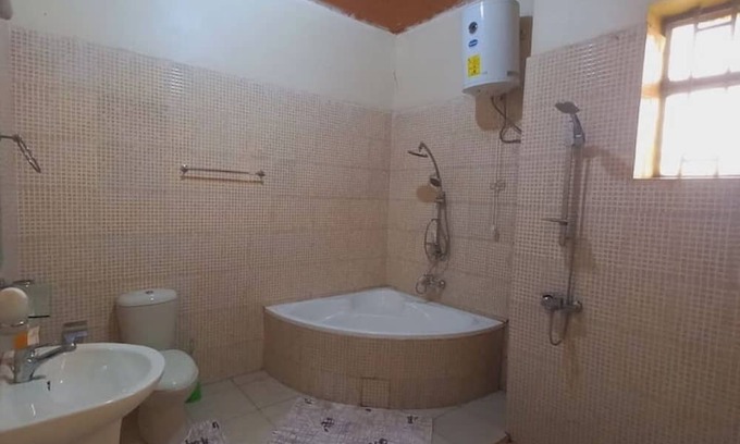 Kinazi House | Cheerful suburban home Nyamata